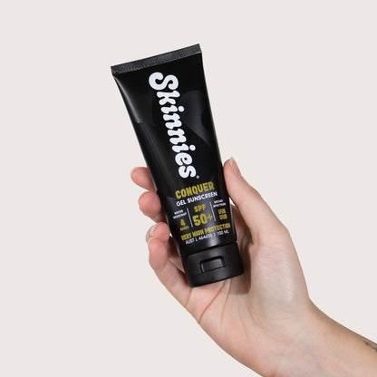 Skinnies CONQUER SPF50+ 100ml in hand