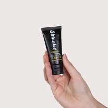 Load image into Gallery viewer, Skinnies CONQUER SPF50+ 35ml in hand